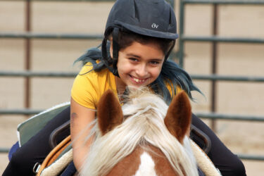 Kid riding a horse